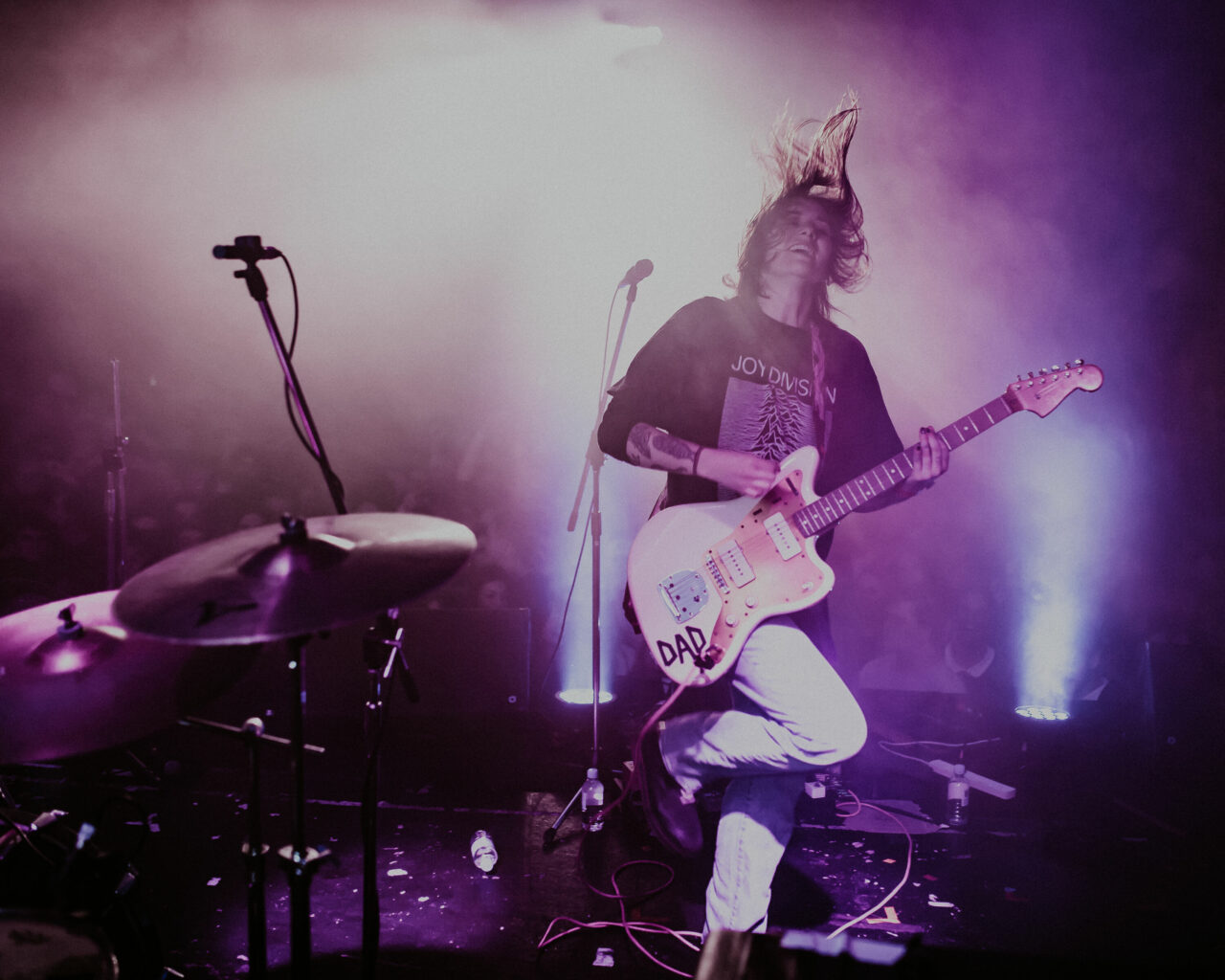 Hockey Dad Guitarist in Action: On-Stage Performance at Selina's with Stage Lighting