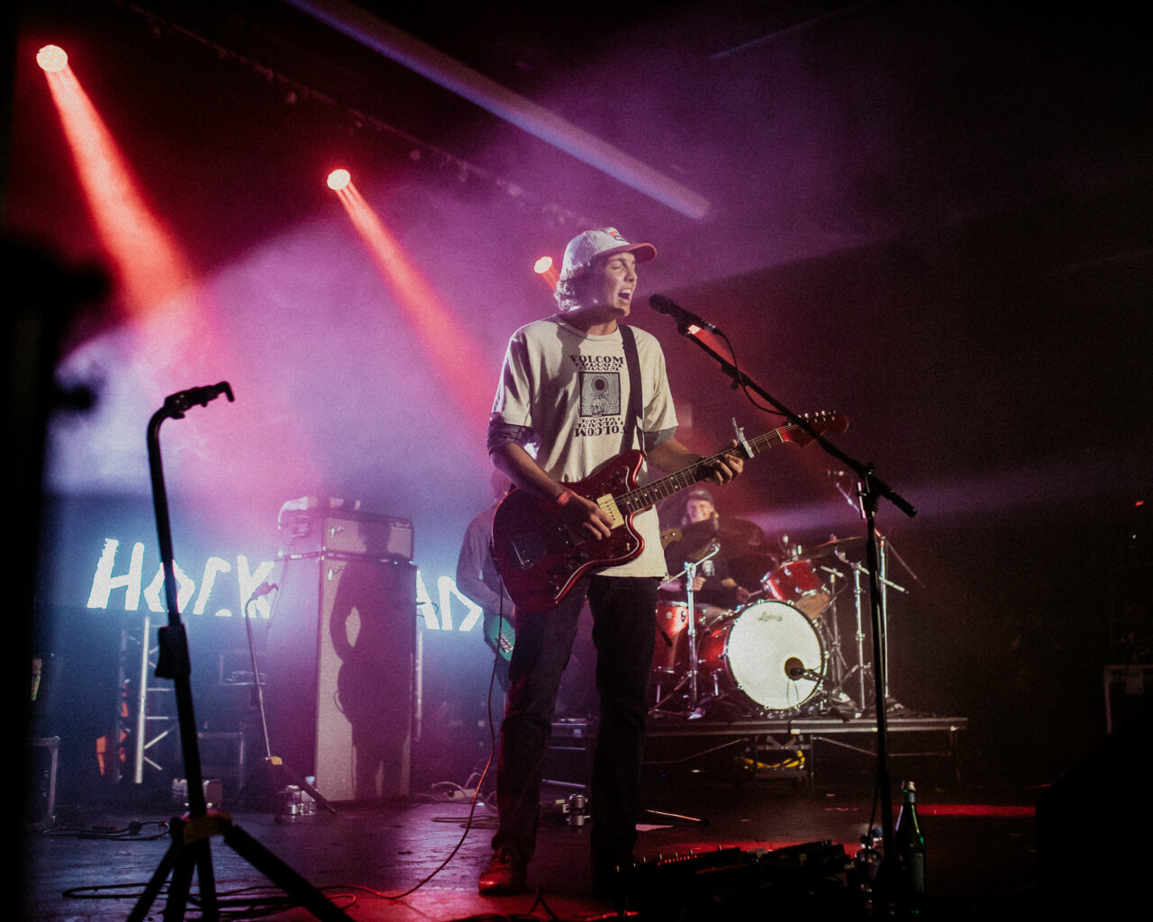 Hockey Dad's Dynamic Lead Singer: Live Performance at Selina's with Striking Stage Lighting